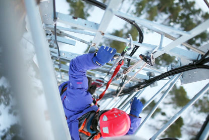 Energy worker climbing down ladder